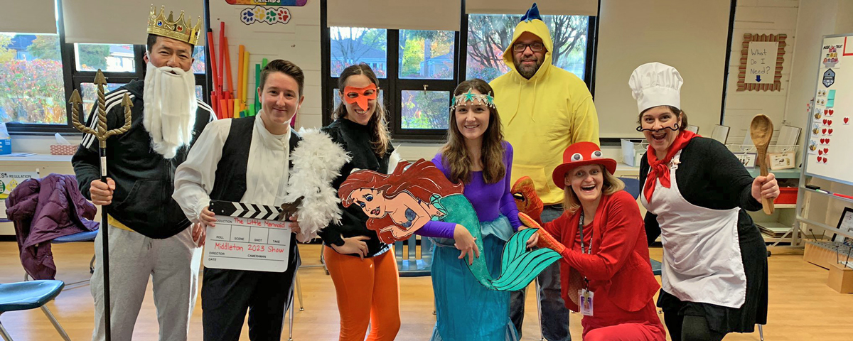 Middleton Exploratories teachers dressed to announce the spring musical, The Little Mermaid Jr. 
