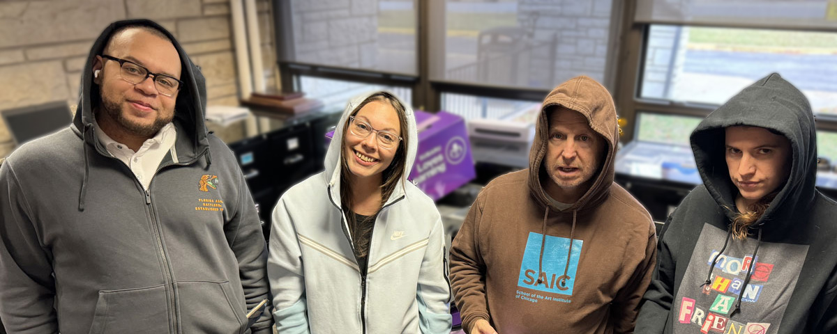 Photo of school office staff wearing dressed in attitude and hoodies