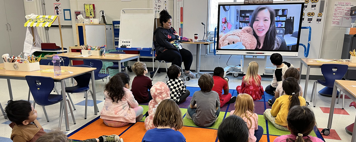 Dr. Wei surprises kindergarten students as their guest reader
