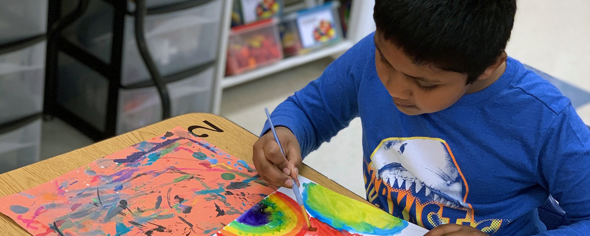 Middleton student paints in the Art Room