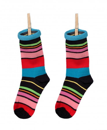 Colorful socks hanging from clothespins